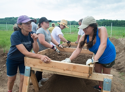 SIUE’s Julie Zimmermann, PhD, (far left) works with undergraduates during the archaeological field school she’s leading.